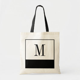 Den eleganta svartvita monogramen hänger lös tygkasse