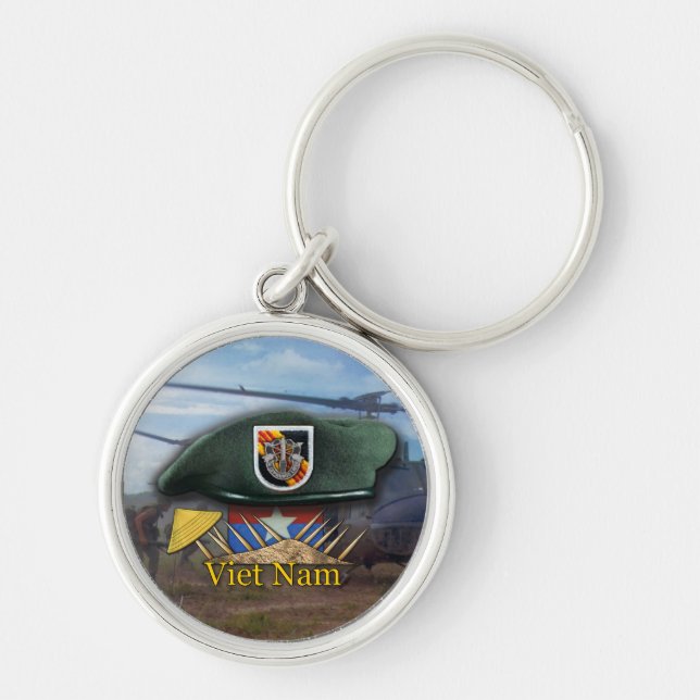 Den femte grönten med speciella krafter innehåller rund silverfärgad nyckelring (Framsidan)