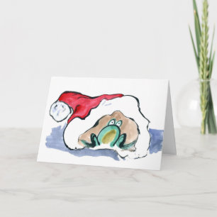 Den gröna grodan sitter insida en Santas hatt Helgkort