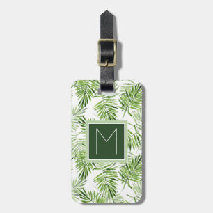 Den gröna handflatan lämnar den monogramen bagagebricka