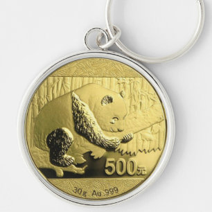 Den guld- pandaen myntar rund silverfärgad nyckelring