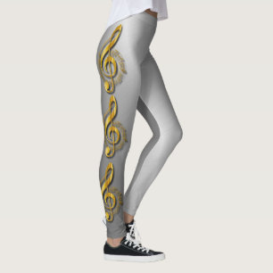 Den guld- Trebleklaven med noterar och skuggar Leggings
