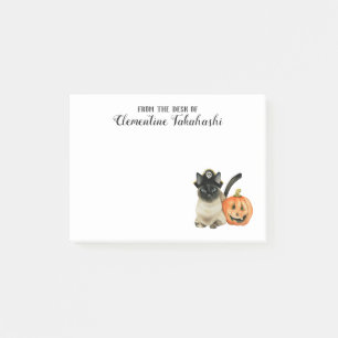 Den gulliga Halloween Siamese katten tillfogar Post-it Block