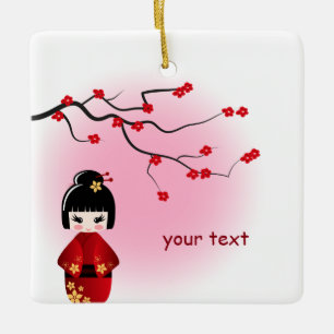 Den japanska kokeshidockan på sakura blomstrar julgransprydnad keramik