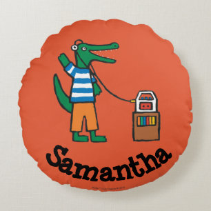 Den kalla krokodilen lyssnar till musik rund kudde