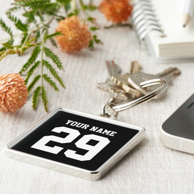 Den kända sportanpassningsbar och numrerar fyrkantig silverfärgad nyckelring (Sidan)