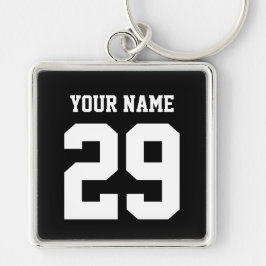 Den kända sportanpassningsbar och numrerar fyrkantig silverfärgad nyckelring