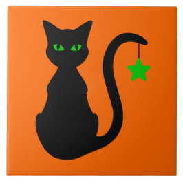 Den keramiska svart katten belägger med tegel kakelplatta
