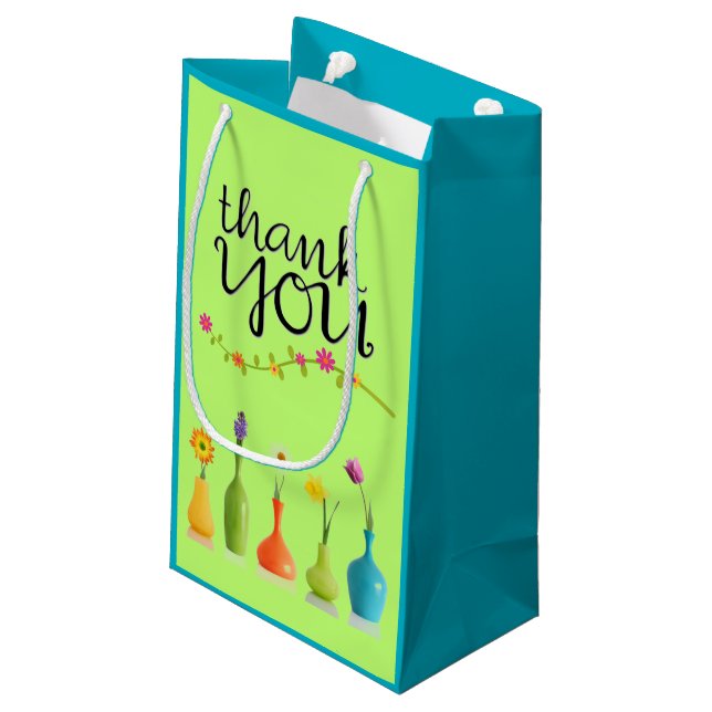 Den ljusa blom- tackgåvan hänger lös (Baksidan Vinklad)