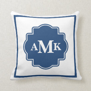 Den marinblåa klassikern och vitmonogramen kudder kudde