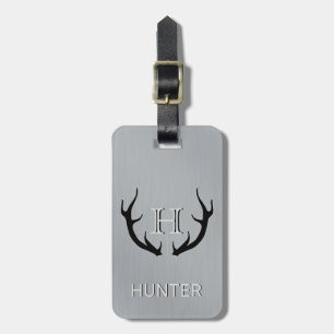 Den metalliska monogramen för horn på kronhjort bagagebricka