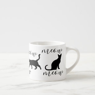 Den moderiktiga svarta katter jamar skrivar espressomugg
