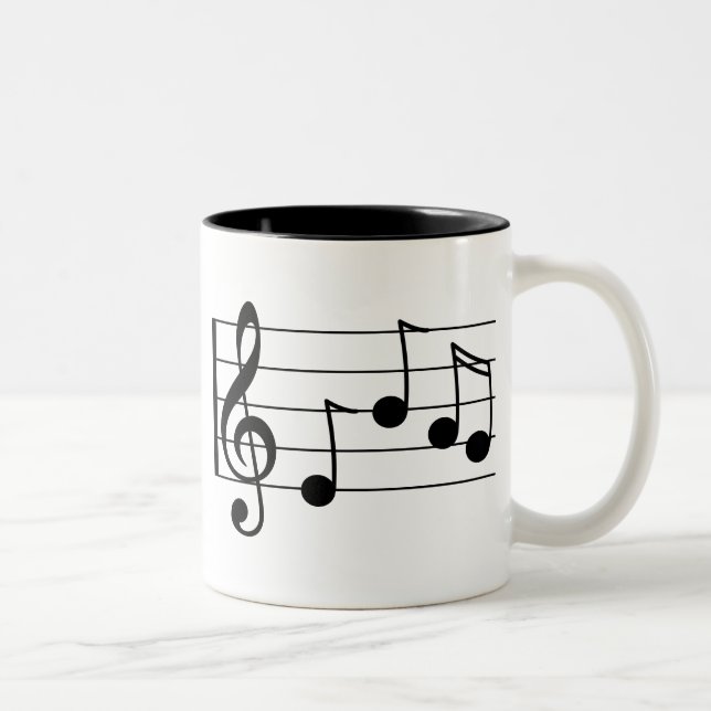 Den musikaliska beteckningssystemtrebleklaven och Två-Tonad mugg (Höger)