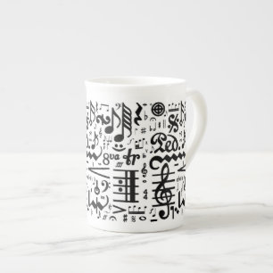 Den musikaliska symbolbenporslinmuggen benporslin mugg