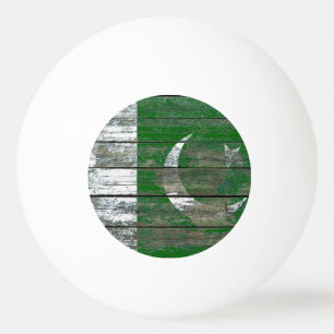 Den pakistanska flagga på grovt trä stiger ombor pingisboll