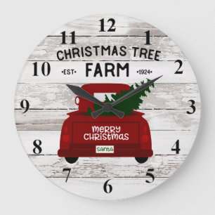 Den röda vintagelastbilen med julgranen tar tid på stor klocka