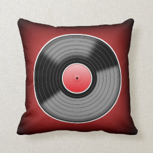 Den röda vinylknarkaren bleknar kvadrerar kudde