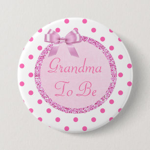 Den rosa mormodern som är baby shower, klämmer knapp