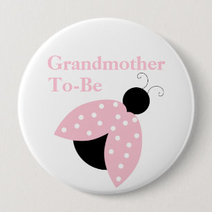 Den rosa nyckelpigamormodern som är baby shower, knapp