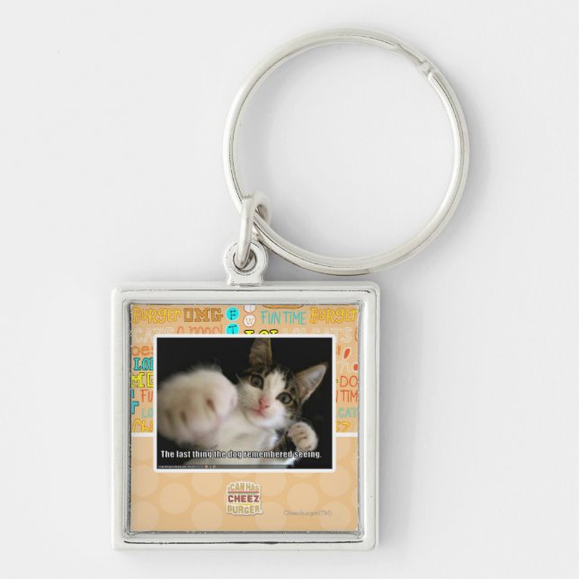 Den sist saken fyrkantig silverfärgad nyckelring (Framsidan)