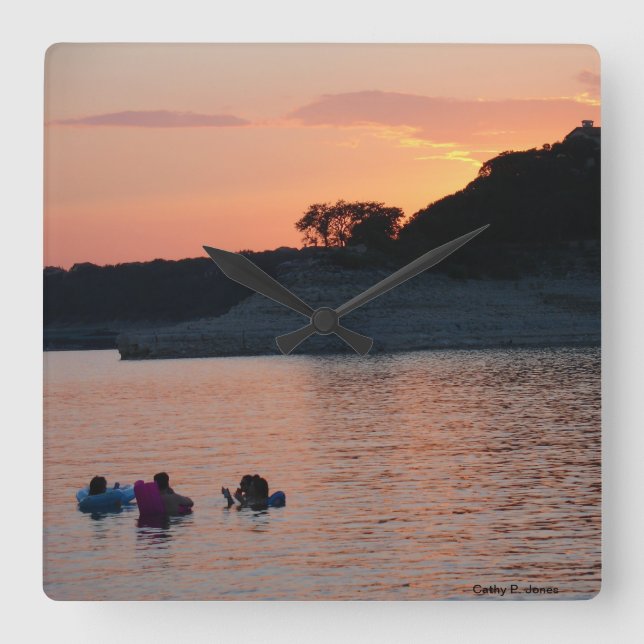 Den sjöTravis solnedgången tar tid på Fyrkantig Klocka (Framsida)