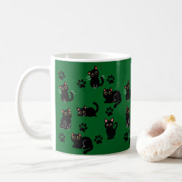 Den söta svarta kattmuggen är en perfekt present f kaffemugg