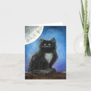 Den svart katten noterar kortet kort