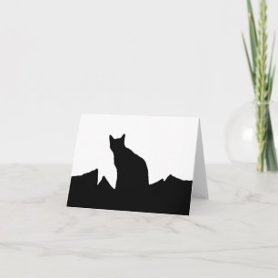 Den svart kattsilhouetten noterar kort