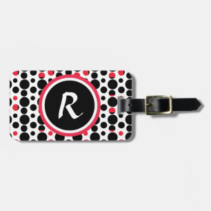 Den svart personifierade monogramen som är röd bagagebricka
