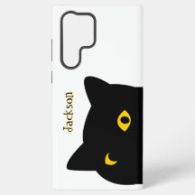 Den svarta katten som tittar på dig med gyllene ög