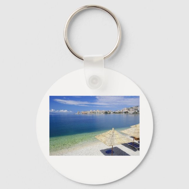 DEN URSNYGGA STRANDEN BESKÅDAR NYCKELRING (Framsida)