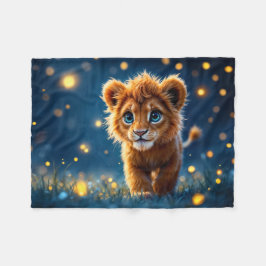 Den vidriga gyllene lejona unge i en drömliknande  fleecefilt