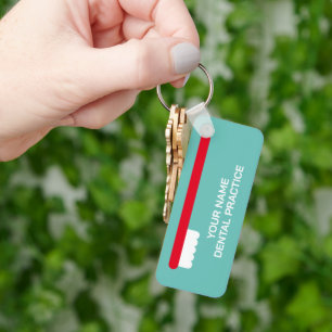 Dentist office keychain with red tandborush logoty nyckelring