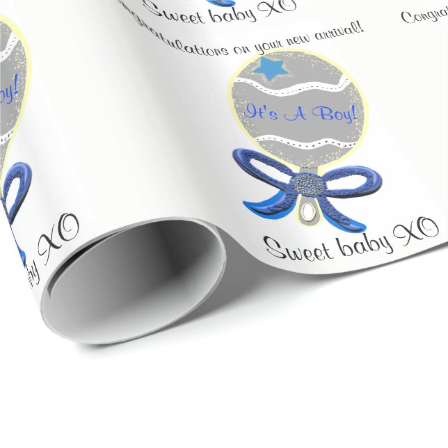 Det är en Boy Blue Baby Rattle Presentpapper (Rullad Hörn)