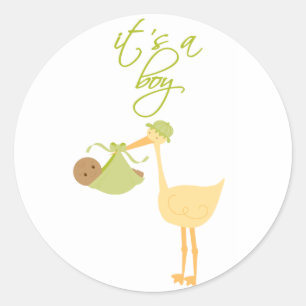 Det är en grönt stork som håller fast baby-klister runt klistermärke