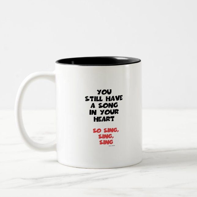DET FINNS EN SÅNG I DIN HJÄRTA Två-Tonad MUGG (Vänster)