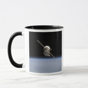 Det Soyuz TMA-11 rymdskepp ovanför jord horiz Mugg