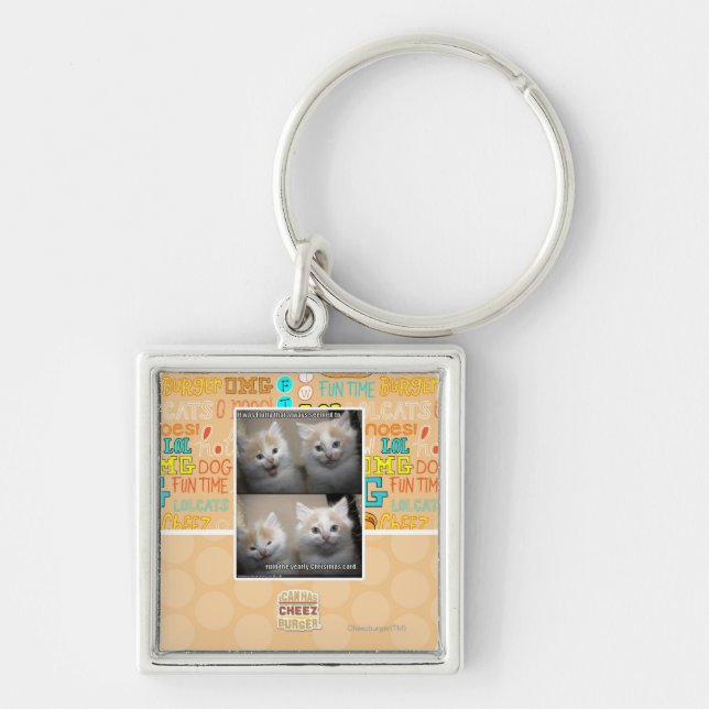 Det var fluffigt fyrkantig silverfärgad nyckelring (Framsidan)