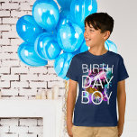 Dinosaur T-rex Birthday Boy T Shirt<br><div class="desc">Fira din lilla speciella dag med våra vibranta pojkars t-shirt med en färgstark graffiti T-Rex-huvuddesign. Öga-fångstdesignen visar en lekfull blandning av färg och en djärv typografi som visar "födelsedagspojke" på framsidan. Den här t-tröjan är tillverkad av mjuk och andningsbar väv och ger dig bekvämlighet för din lilla äventyrare när de...</div>