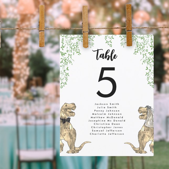 Dinosaur-tema för bröllopsbordets sittplatsschema (Dinosaur themed wedding T-Rex bride and groom with jungle foliage table seating chart)