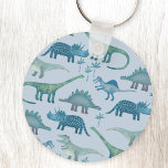 Dinosaurs Blue Nyckelring<br><div class="desc">Cute och inte särskilt skrämmande dinosaurier på en blå bakgrund.</div>