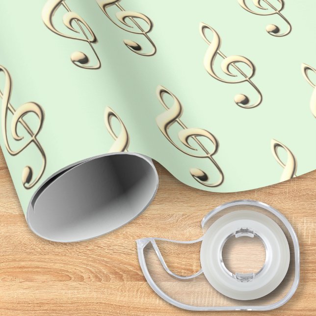 Diskantnyckel Musikaliskt Symbol Musikälskares Grö Presentpapper (A music themed roll of gift wrapping paper, in light green with pattern of faux gold treble clefs)