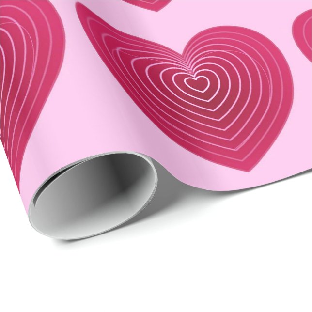 Djupa ro-röda hjärtan på blekens rosa presentpapper (Rullad Hörn)