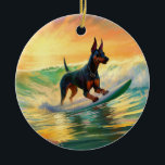 Doberman Beach Surfing Painting Julgransprydnad Keramik<br><div class="desc">Lägg dig i den lekande världen i hund äventyr med den här fängslande målningen. En andlig hund tar sig till vågar och kör skickligt surfan på en strand som kysstes av sol. Den sjudande konsten fångar på ett vackert sätt kärnan i den upphetsning som finns vid sidan av när hund...</div>