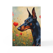 Doberman i fält om blommor
