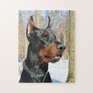 Doberman pinscher i snö pussel