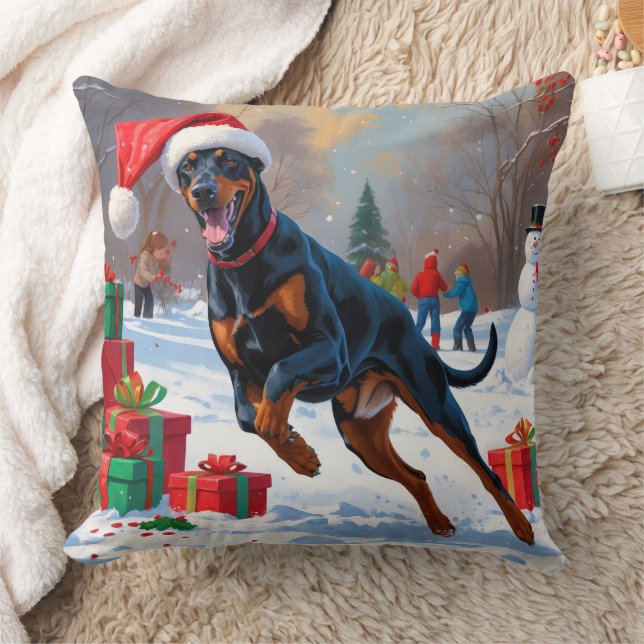 Dobermann springer i snö med julhatt kudde (Filt)