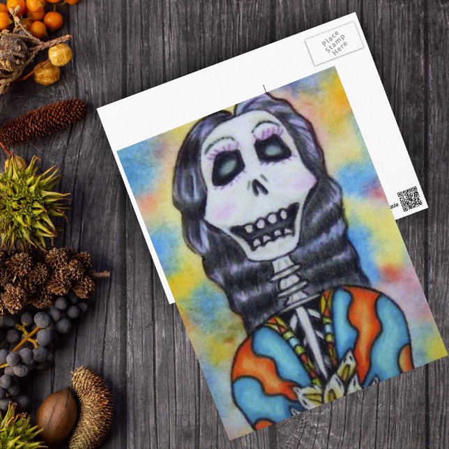 Döda dagen vykort (Day of Dead happy lady skeleton orange blue cape flowers on postcard.)