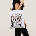 Dog Mom Leopard Print Tote Bag Tygkasse<br><div class="desc">This fierce and adorable Dog Mom tote bag is made for every proud dog mama! Bold leopard print “DOG” with elegant cursive “Mom” sits perfectly with cute paw prints, hearts, sparkles and bones. It’s the perfect everyday bag for groceries, books, dog park walks or just showing off your dog love....</div>
