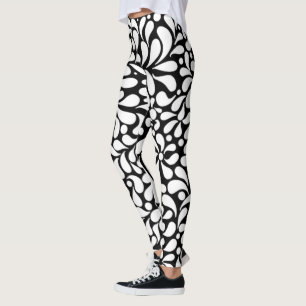 Dold modern vit blomma i svart bakgrund leggings